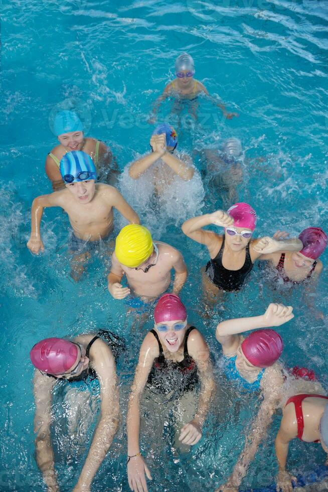 happy children group  at swimming pool photo