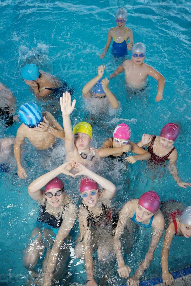 happy children group  at swimming pool photo