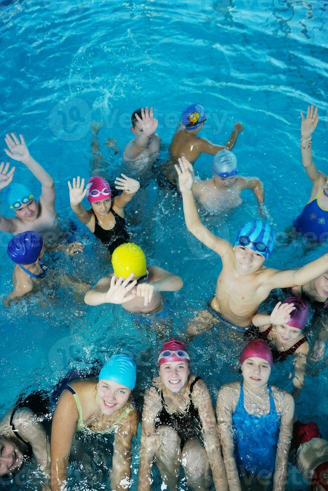 happy childrens at swimming pool photo