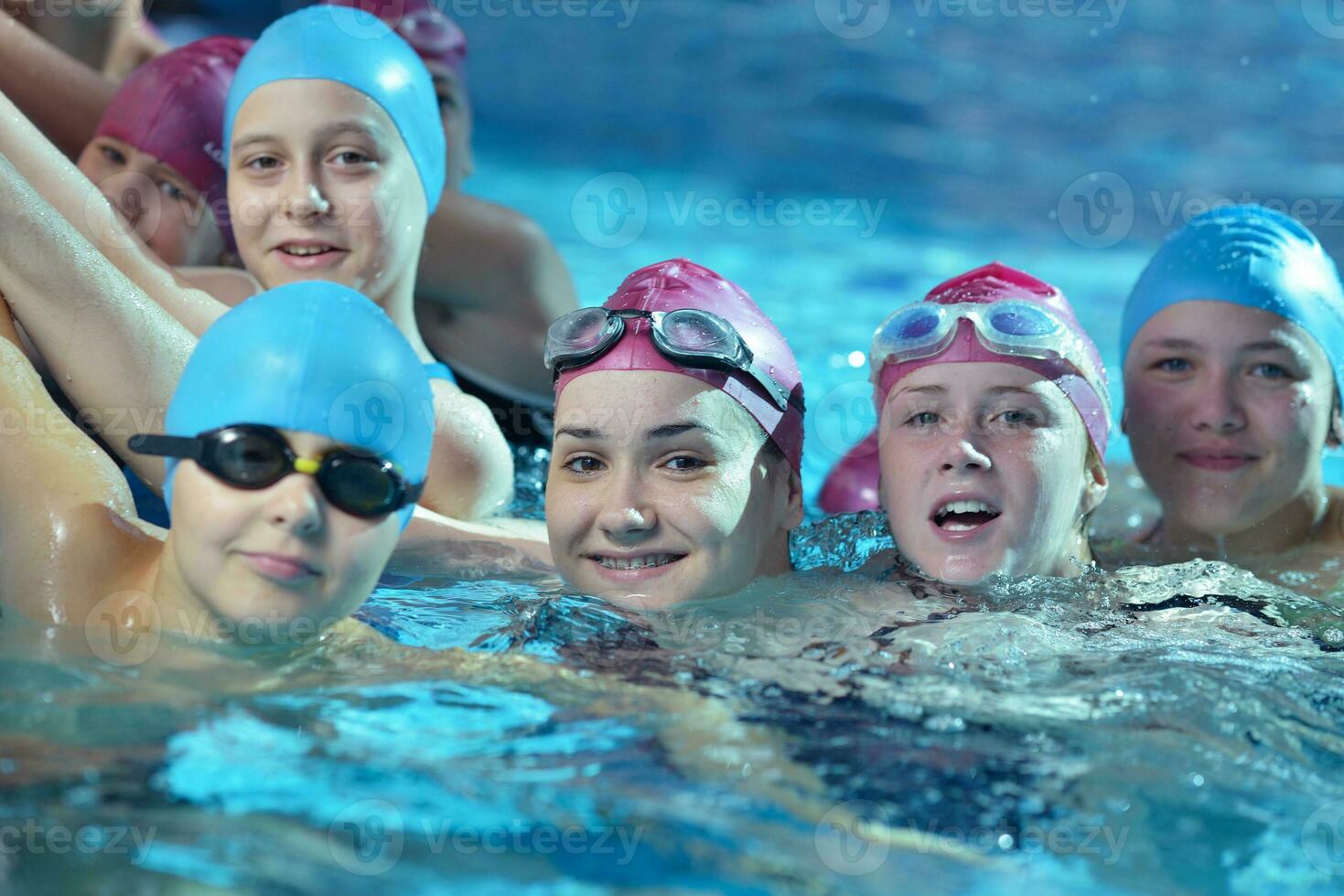 happy children group  at swimming pool photo