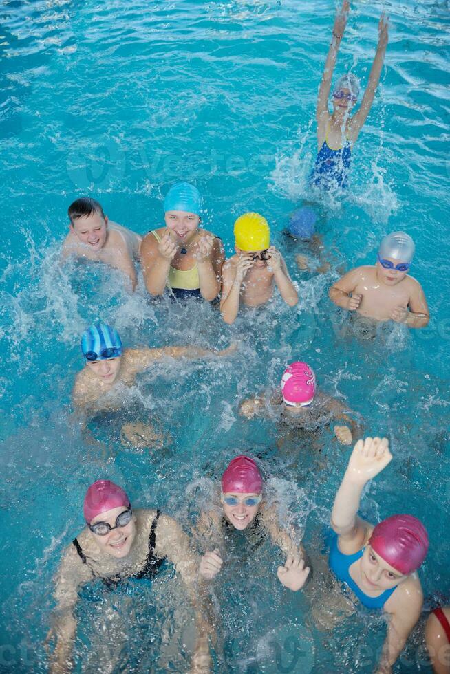 happy children group  at swimming pool photo