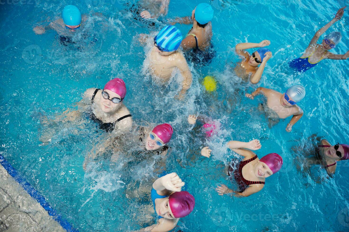 happy childrens at swimming pool photo