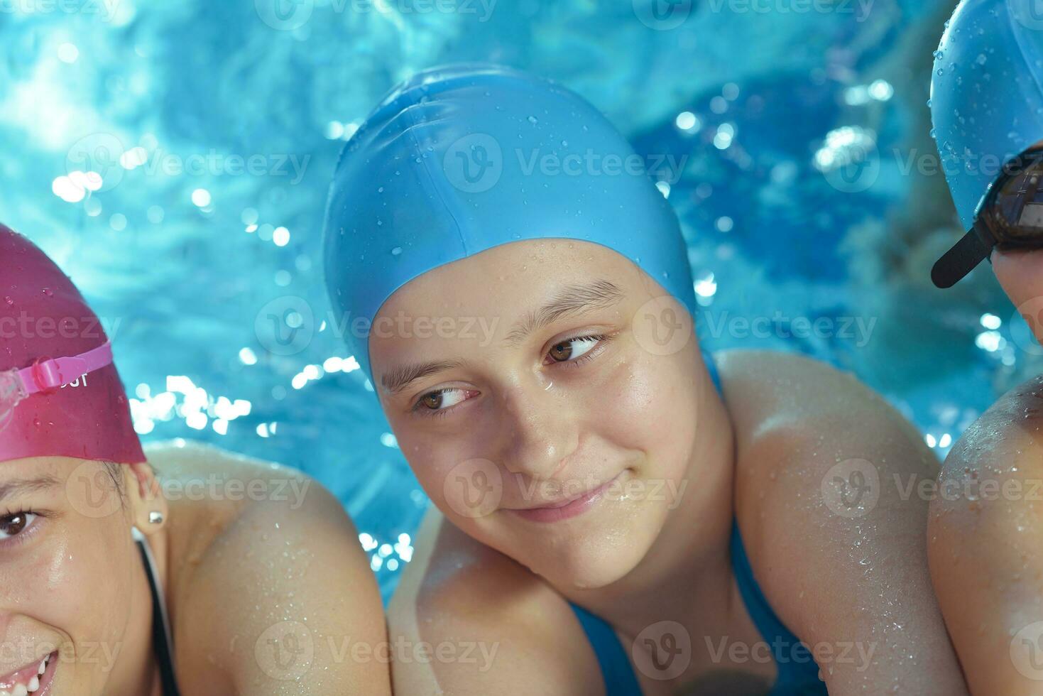 happy children group  at swimming pool photo