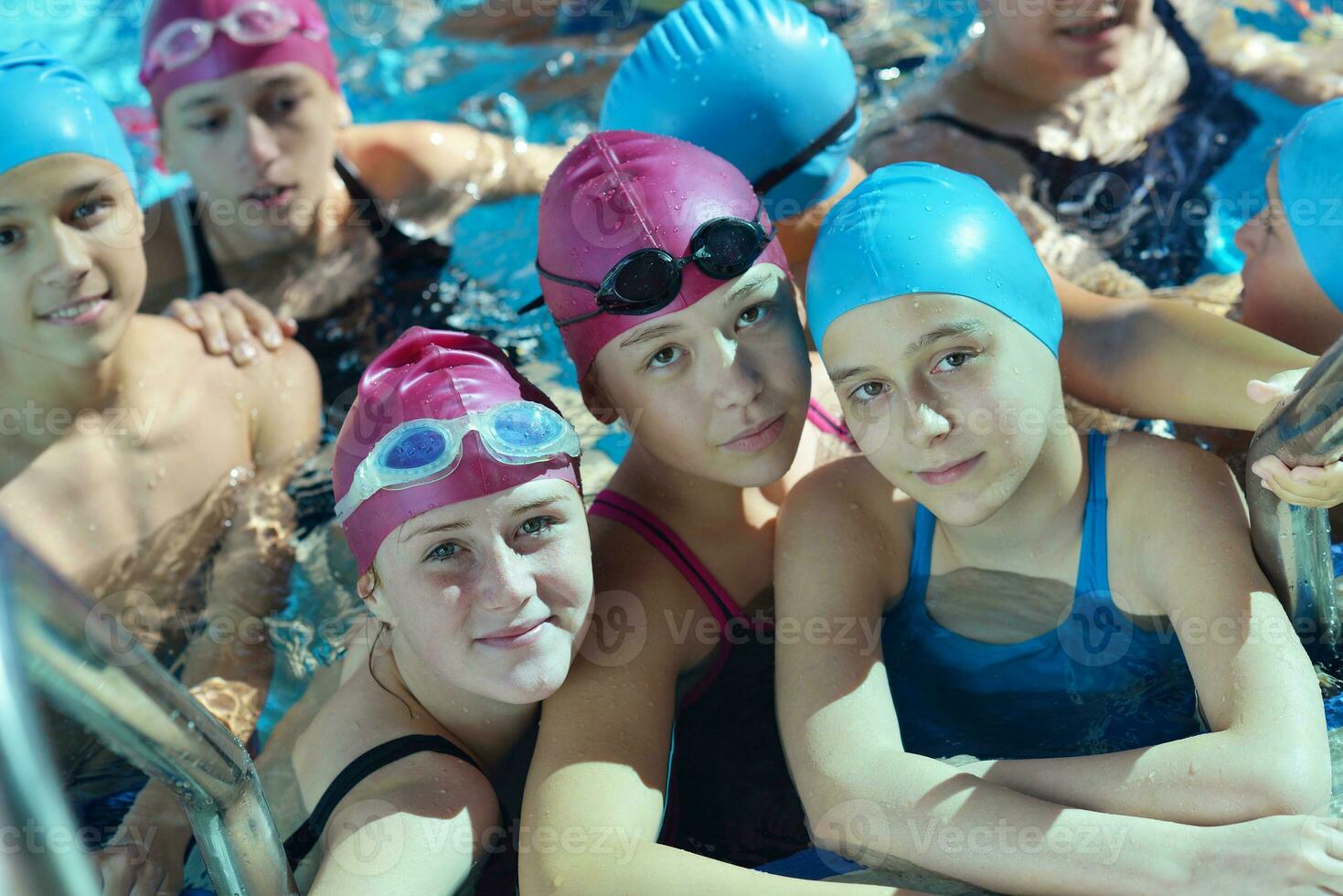 happy children group  at swimming pool photo
