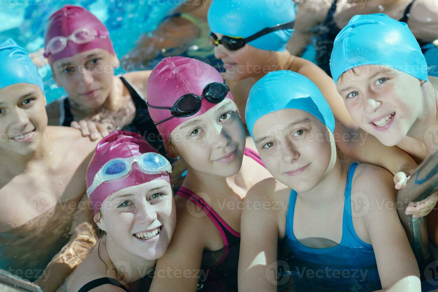 happy children group  at swimming pool photo