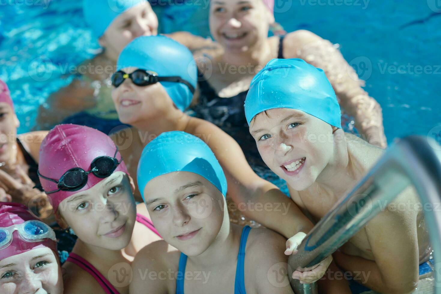 happy children group  at swimming pool photo