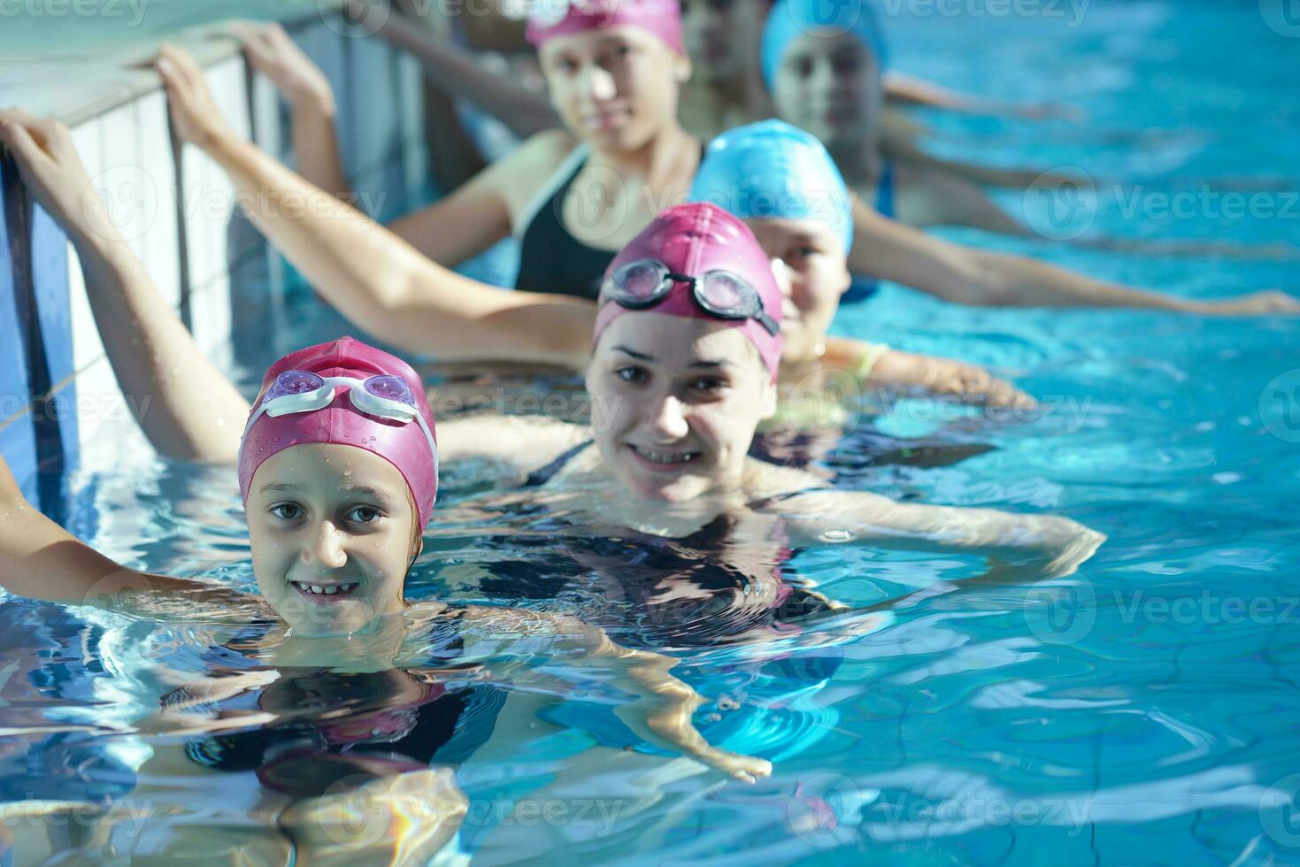 happy children group  at swimming pool photo