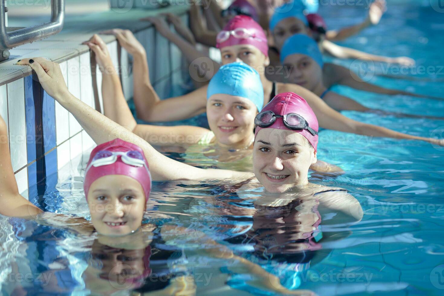 happy children group  at swimming pool photo