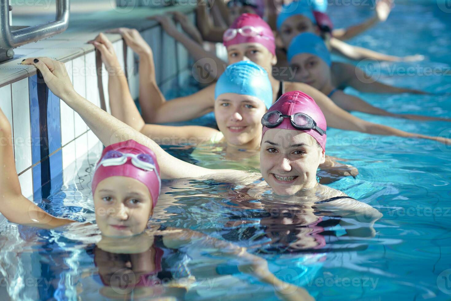 happy children group  at swimming pool photo