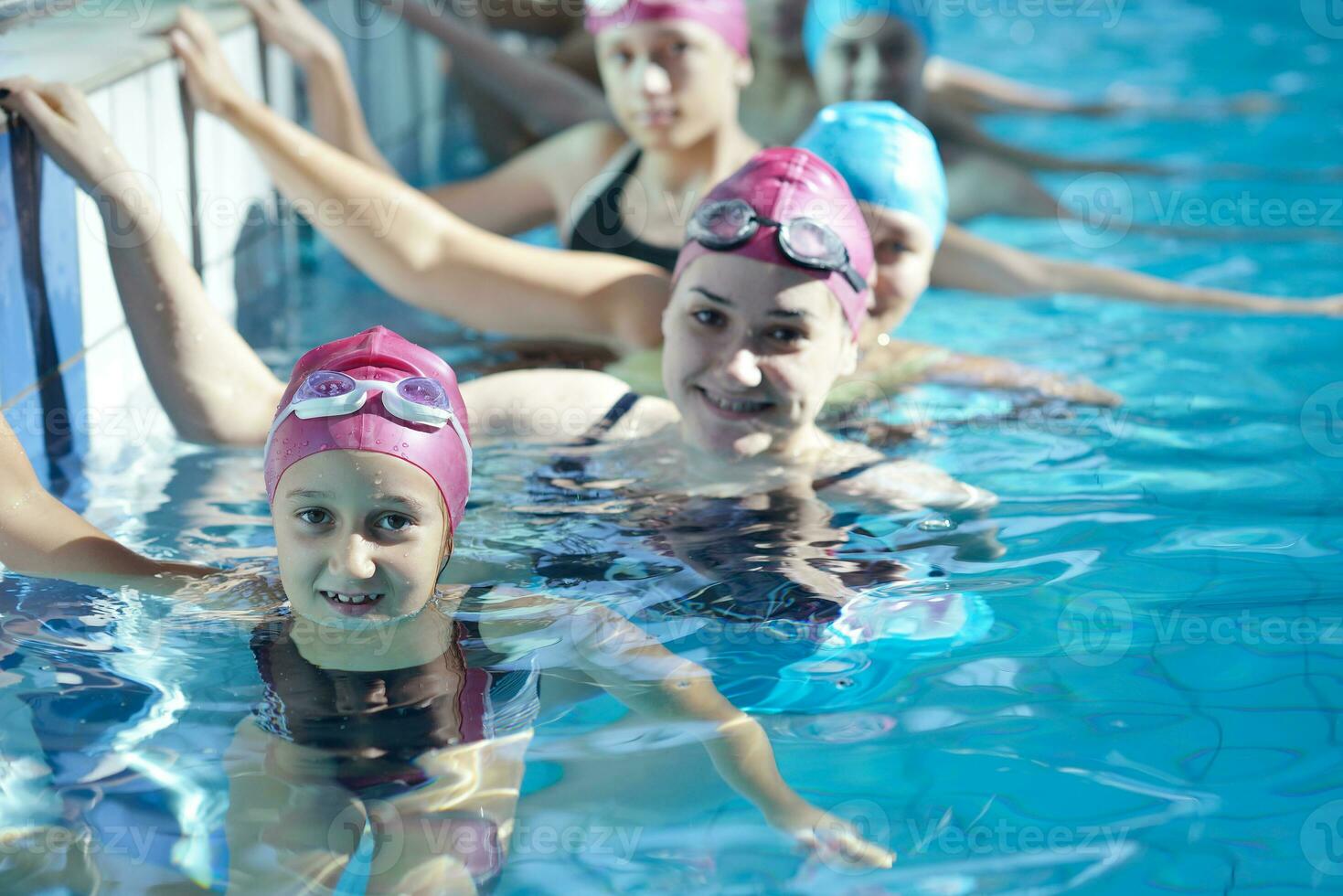 happy children group  at swimming pool photo