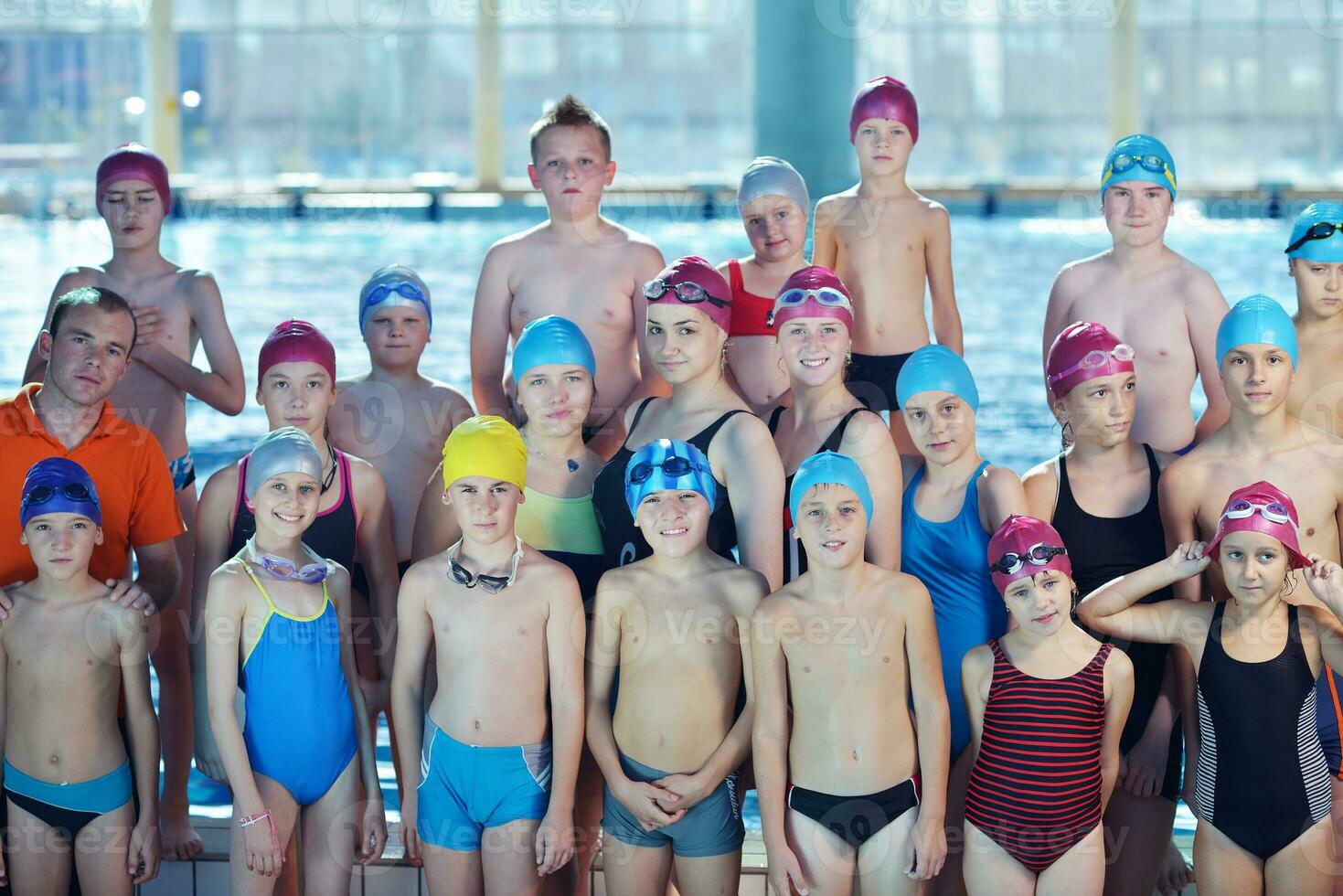 happy children group  at swimming pool photo