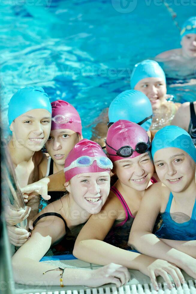 happy children group  at swimming pool photo