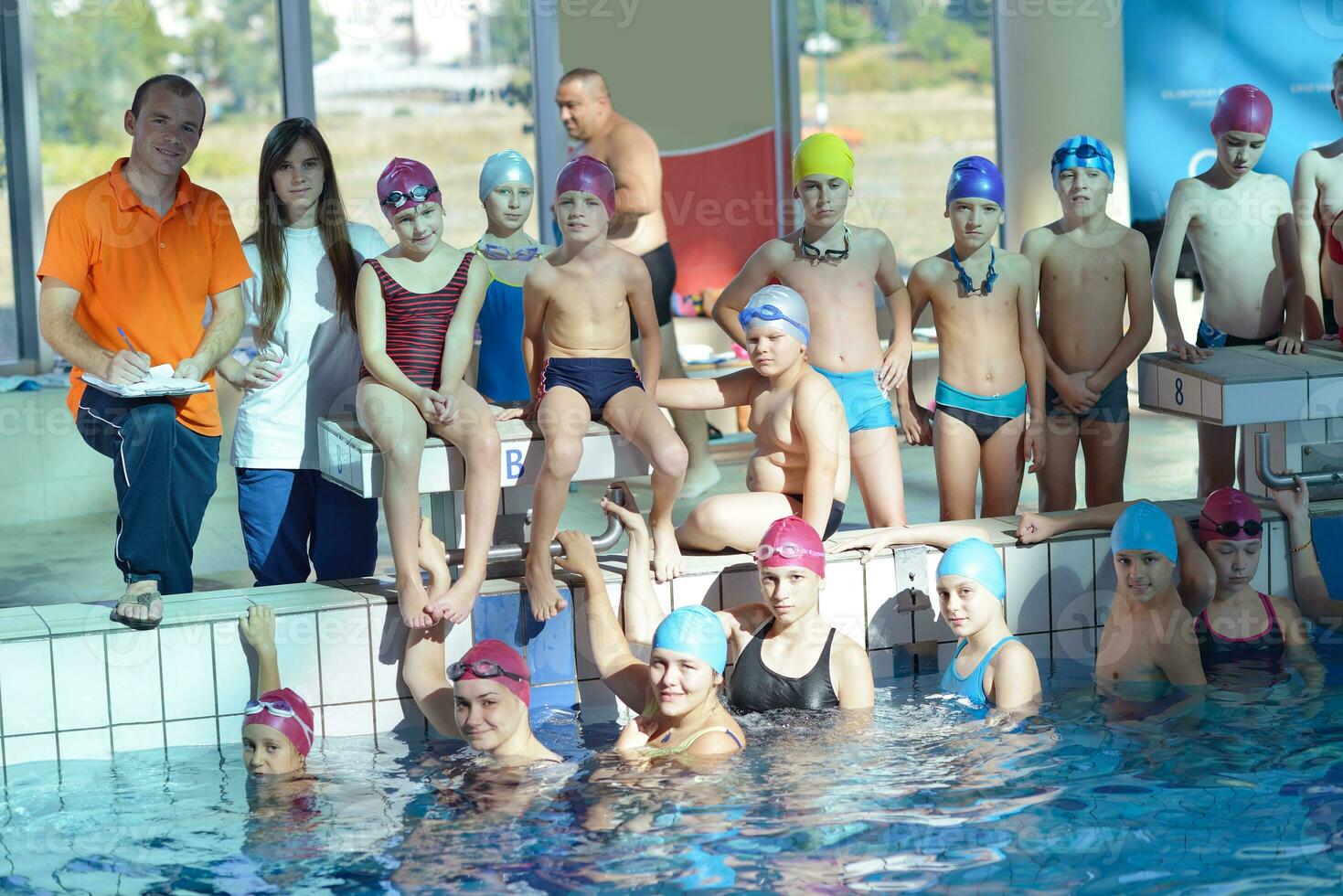 happy children group  at swimming pool photo