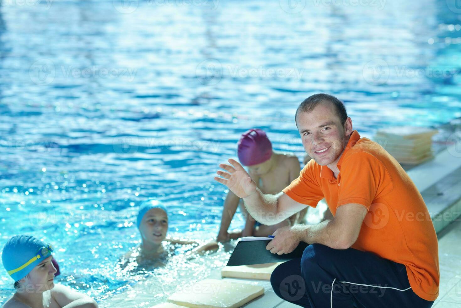 happy children group  at swimming pool photo