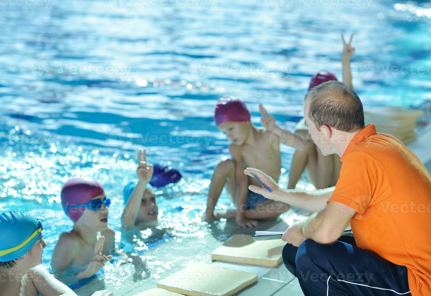 happy children group  at swimming pool photo