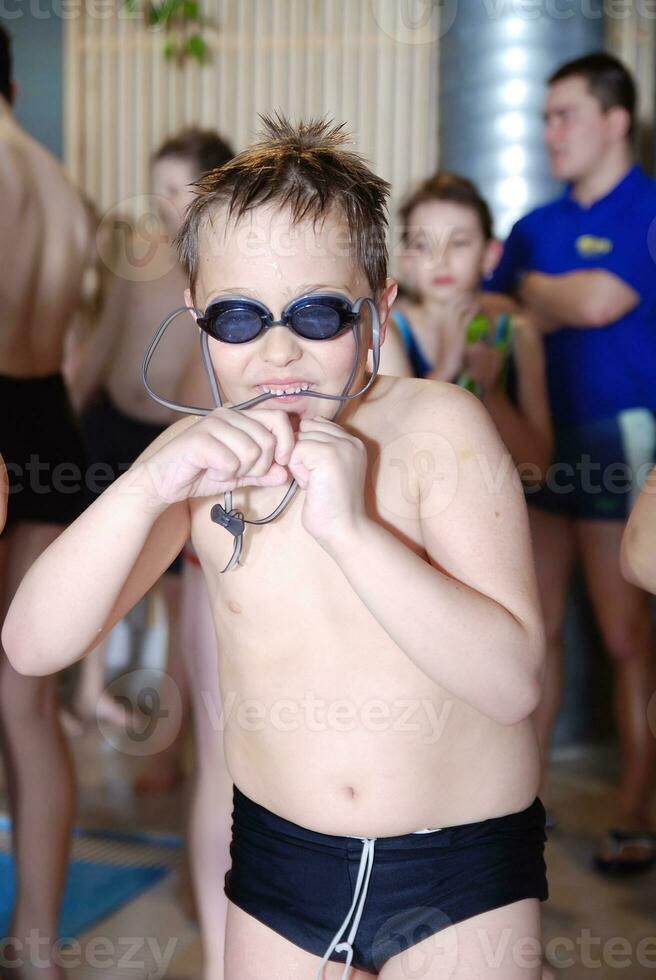 .children having fun at swimming pool photo