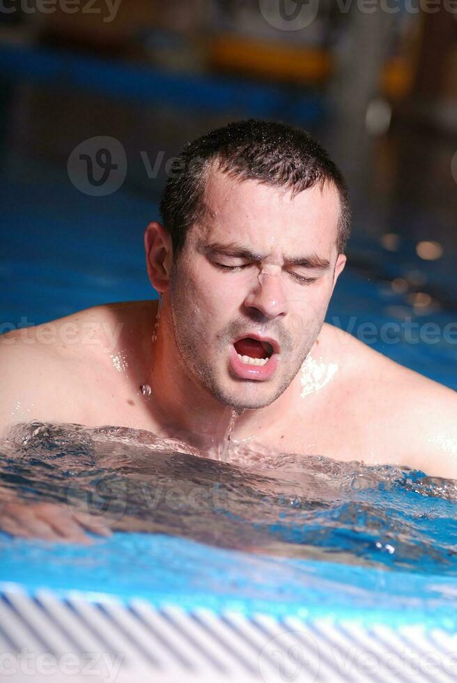 .man in swimming pool photo