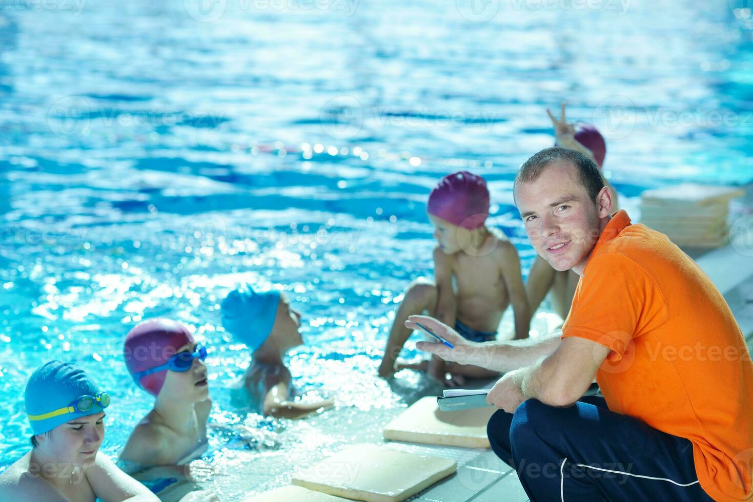 happy children group  at swimming pool photo