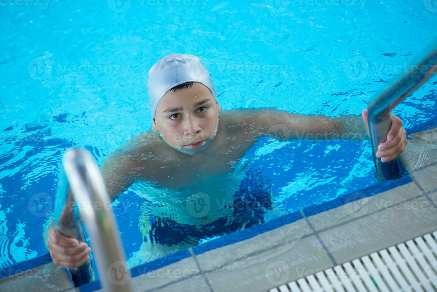 child on swimming poo photo