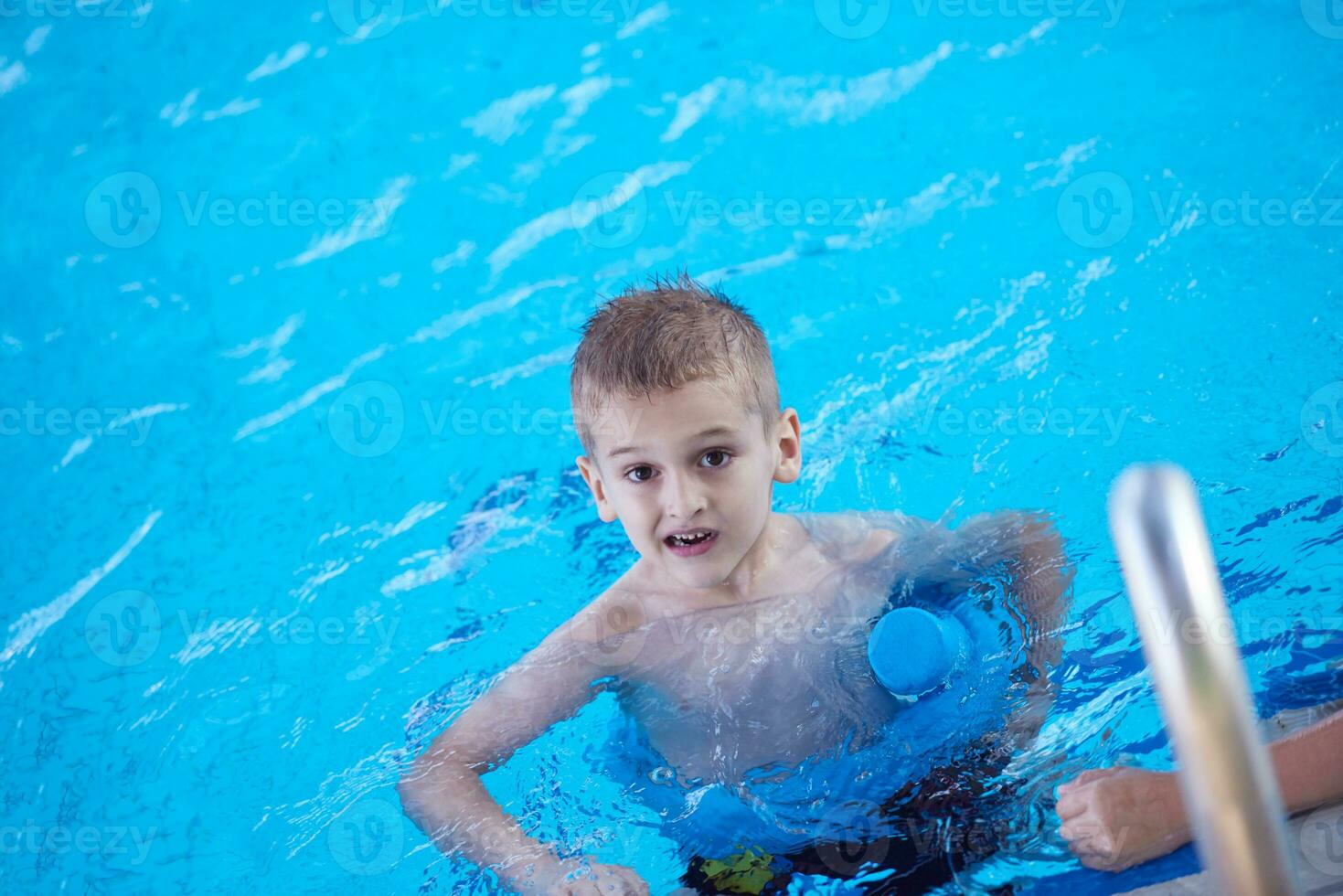 child on swimming poo photo