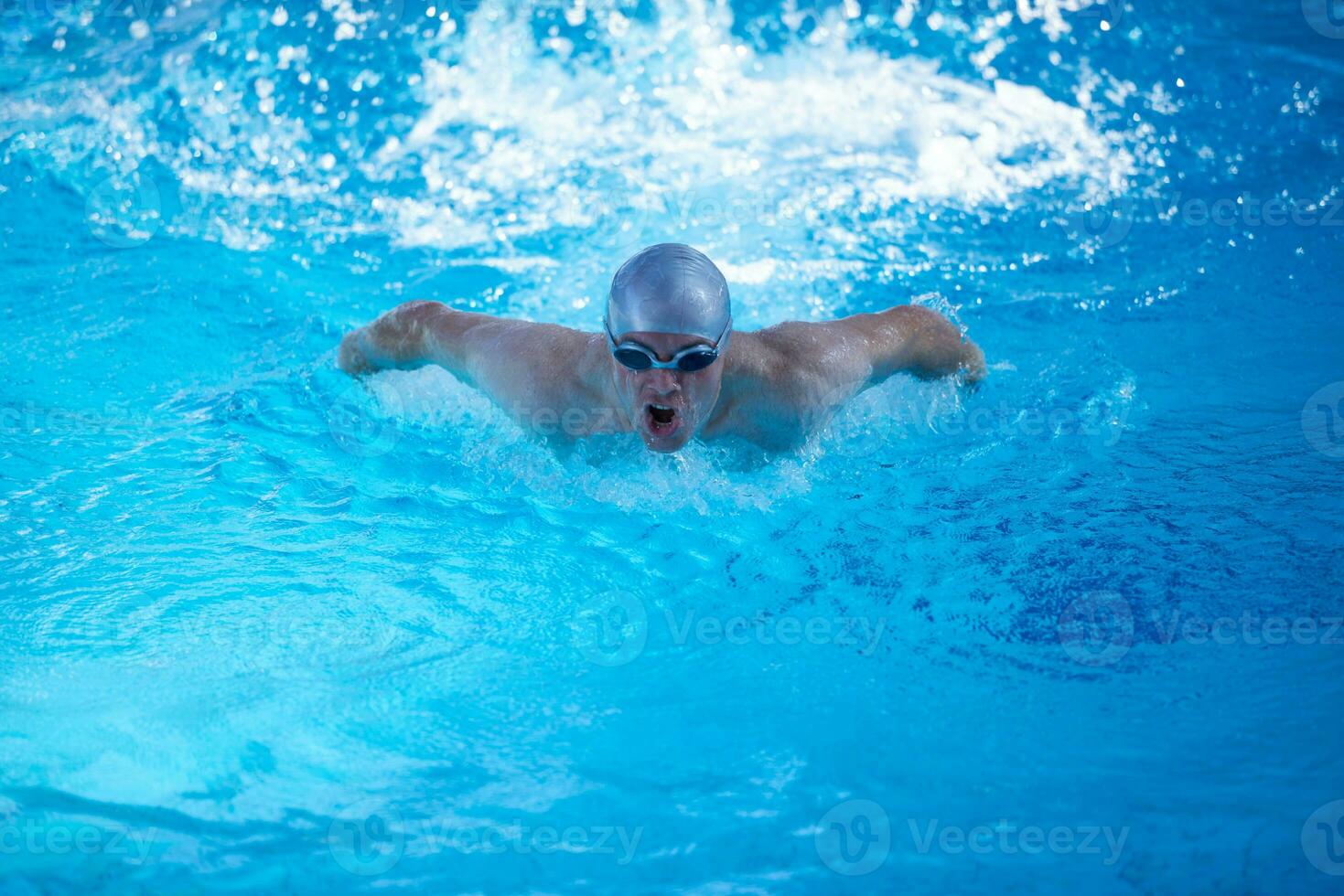 swimmer excercise on indoor swimming poo photo