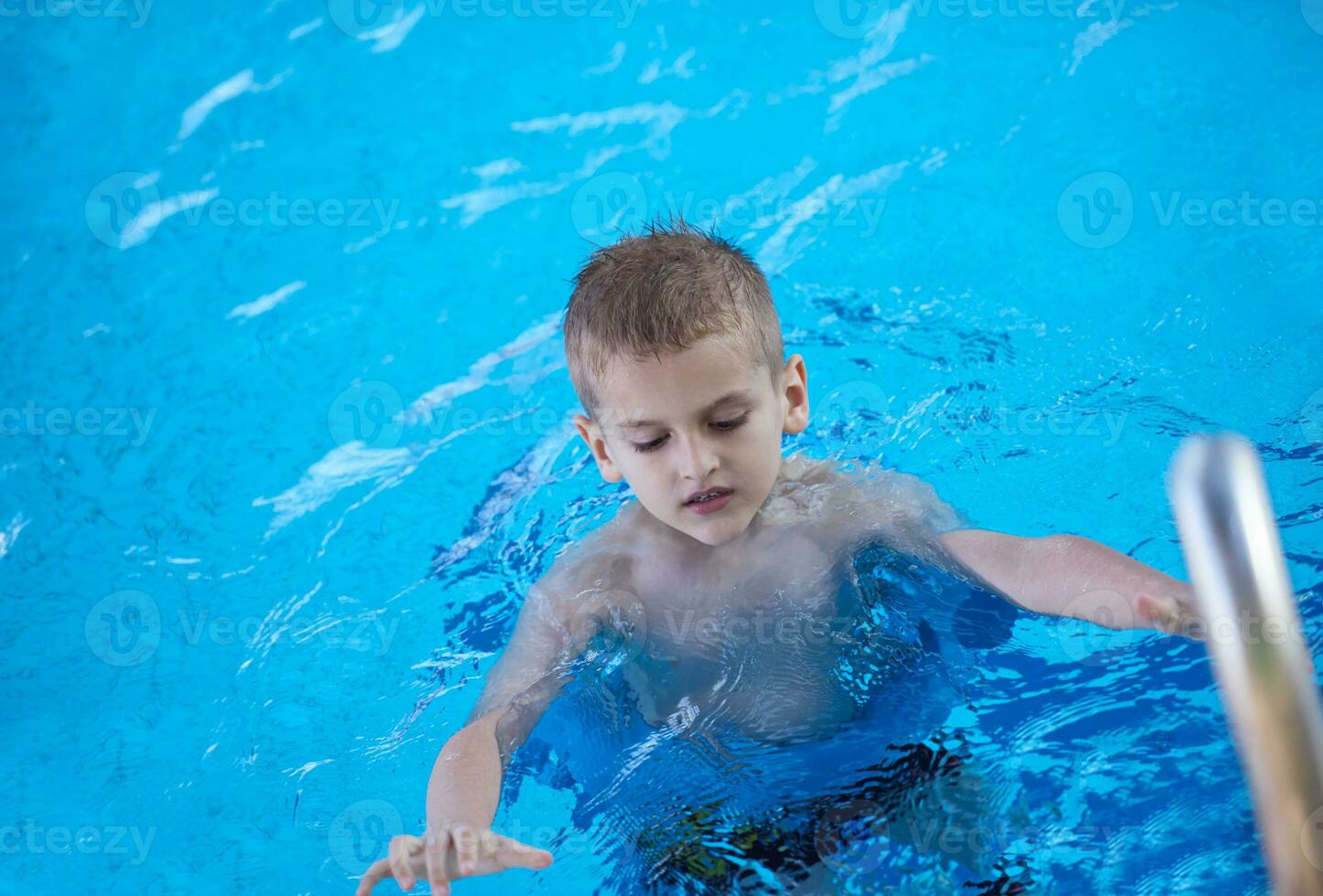 child on swimming poo photo