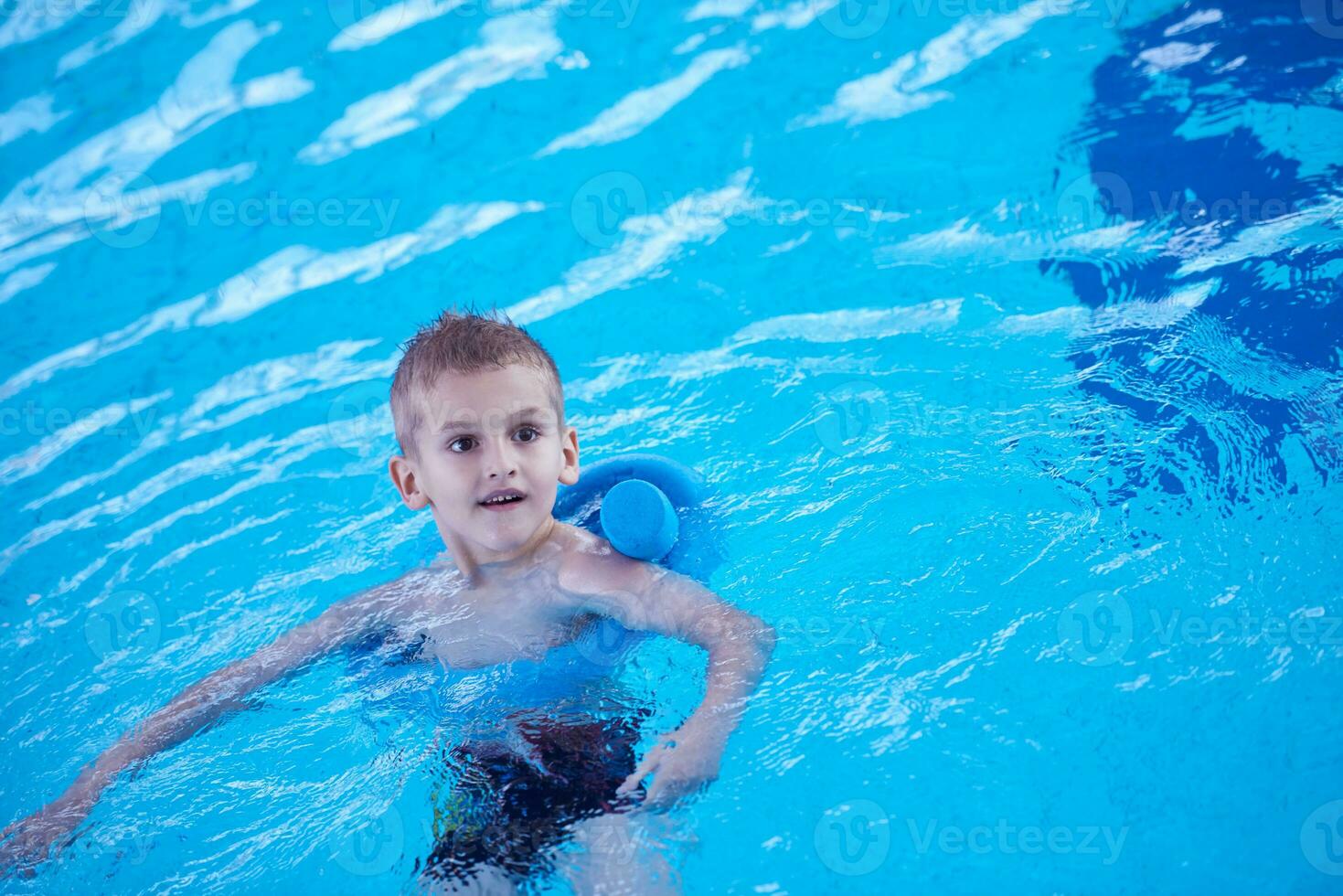 child on swimming poo photo