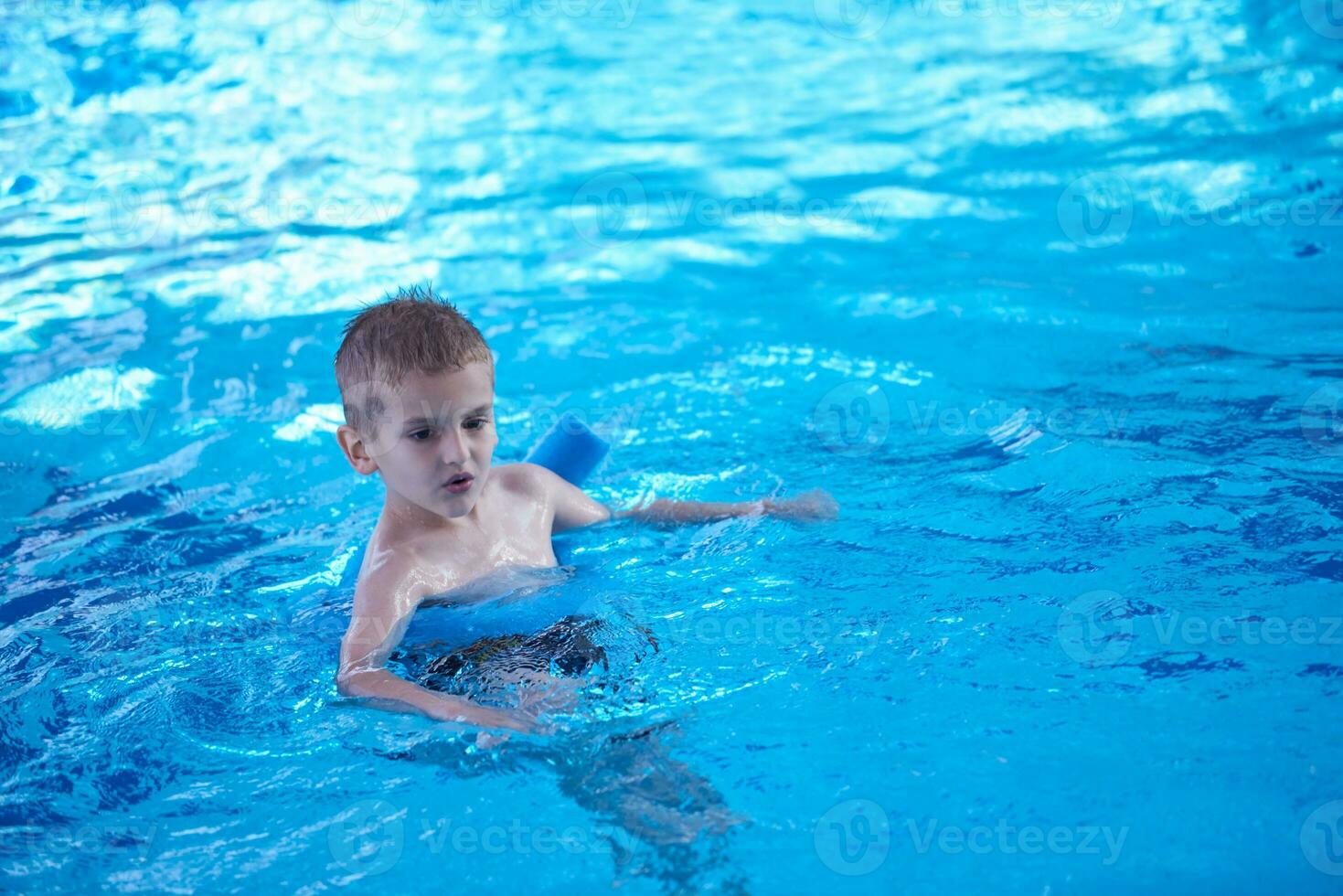child on swimming poo photo