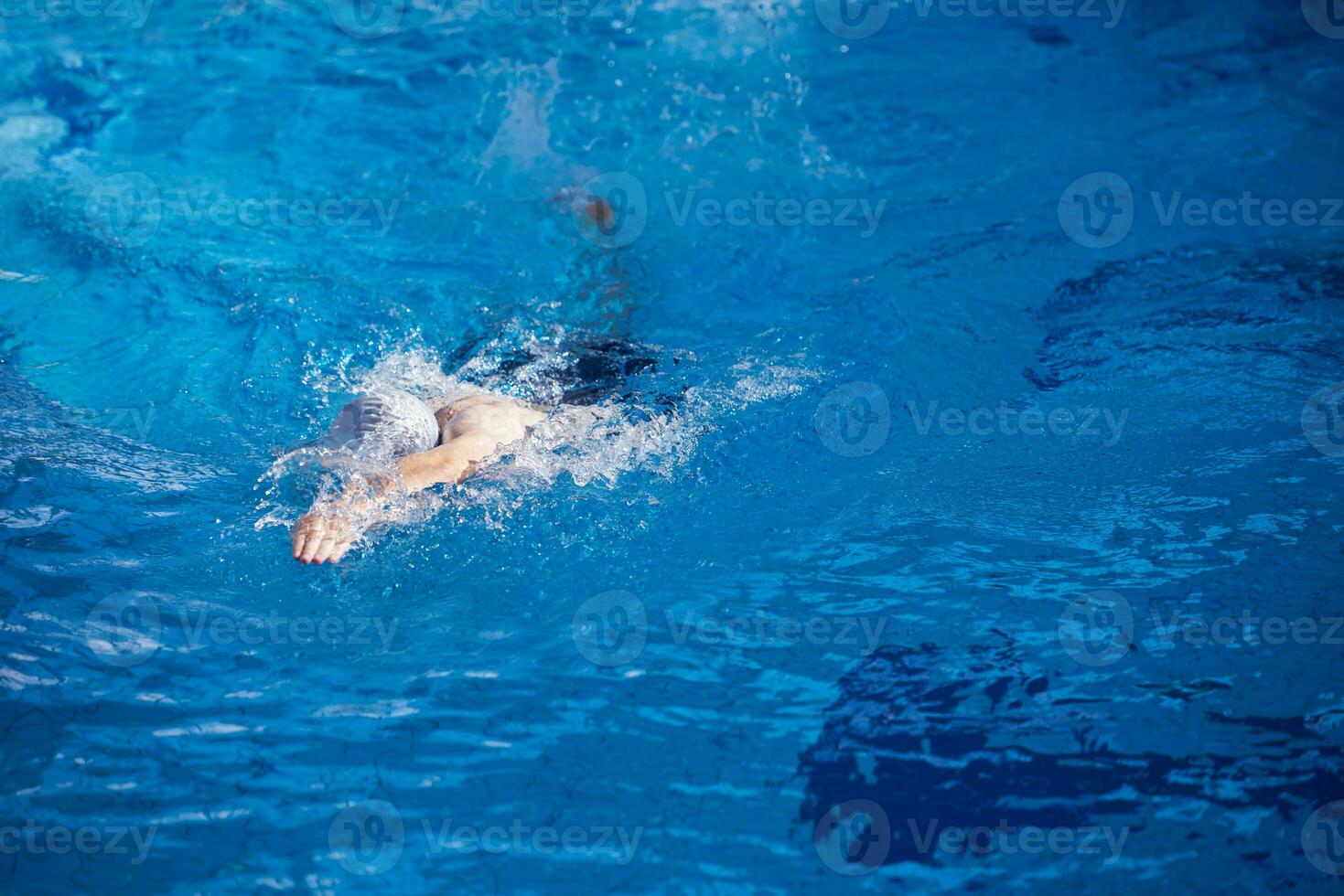 swimmer excercise on indoor swimming poo photo