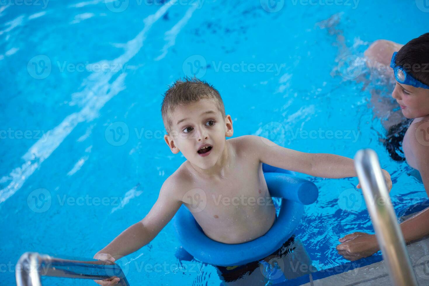 child on swimming poo photo
