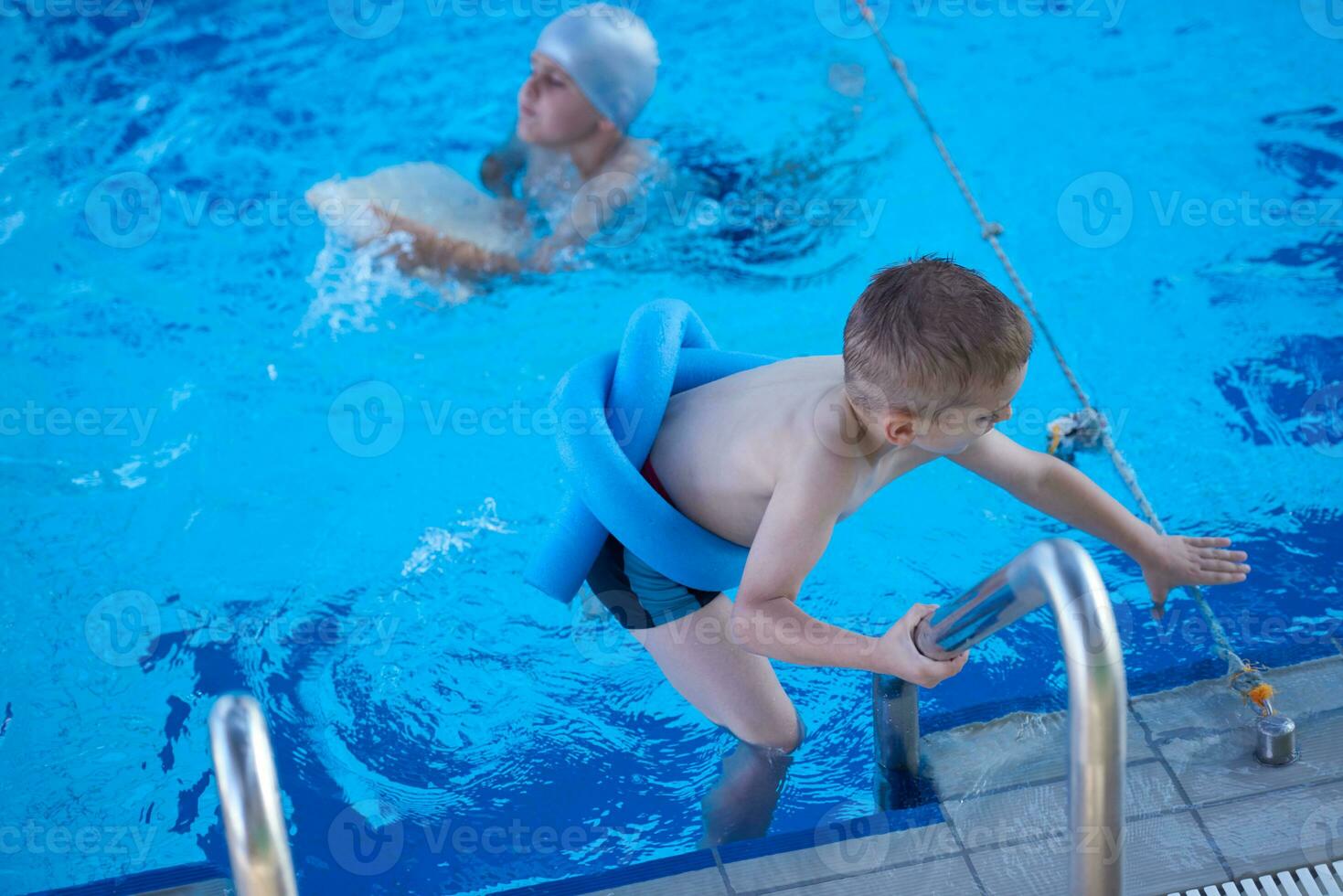 child on swimming poo photo