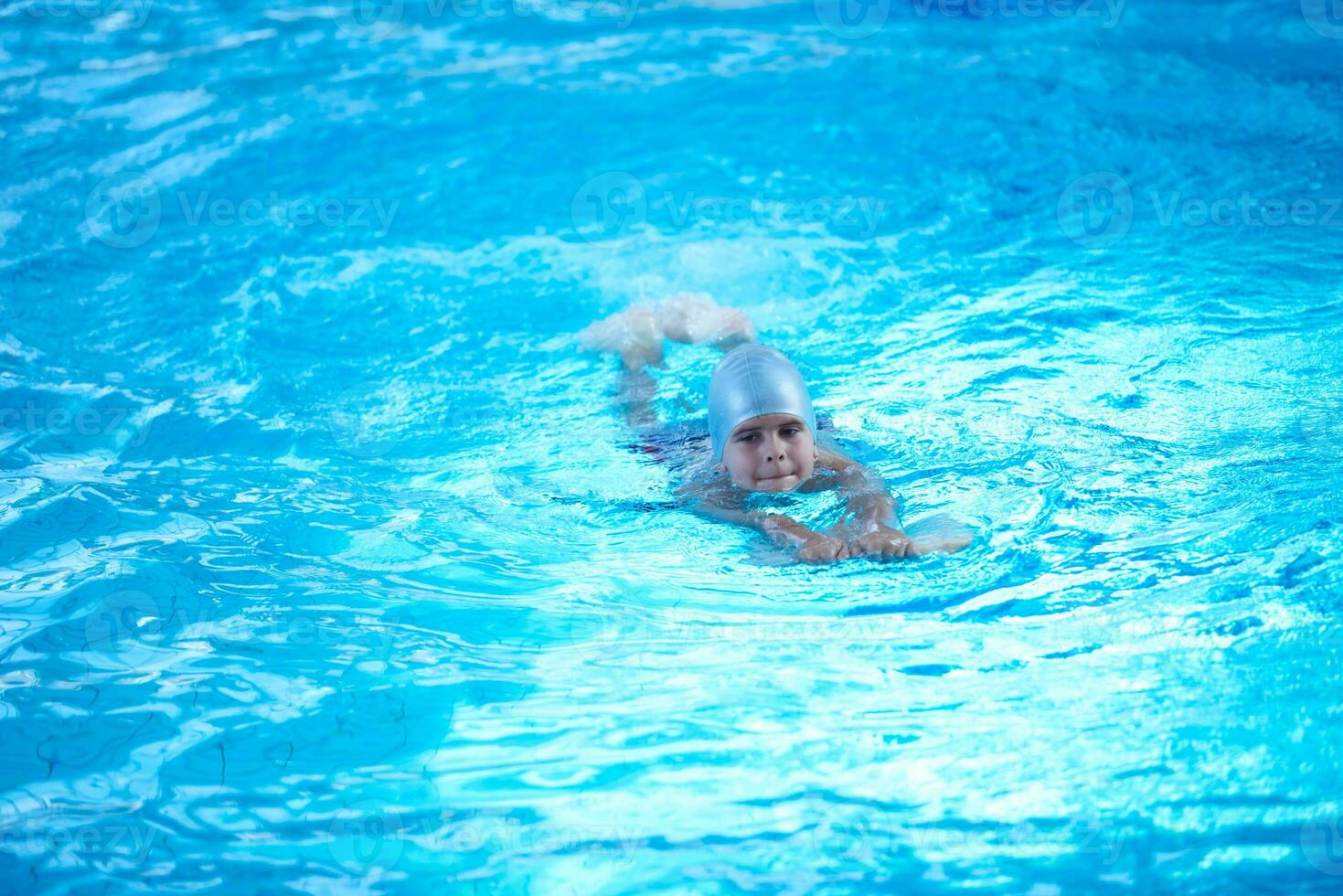 child on swimming poo photo