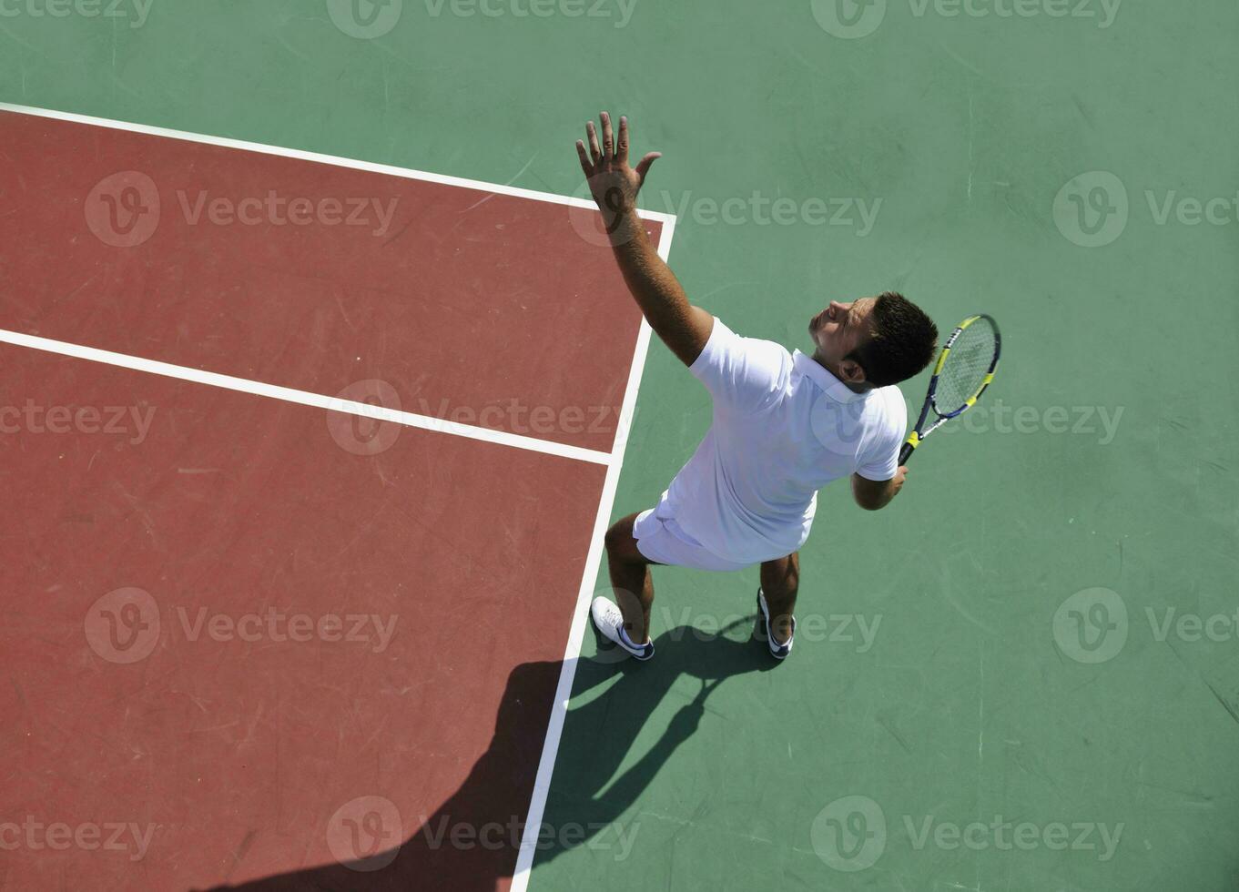 young man play tennis outdoor photo