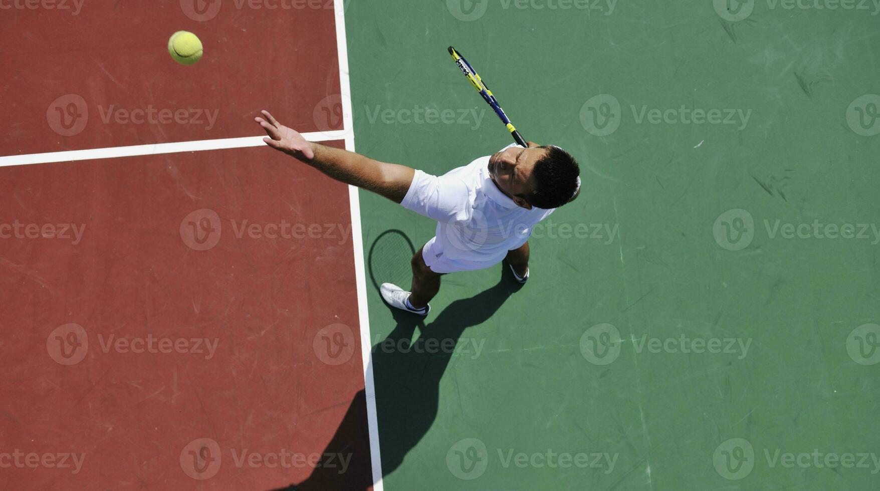 young man play tennis outdoor photo