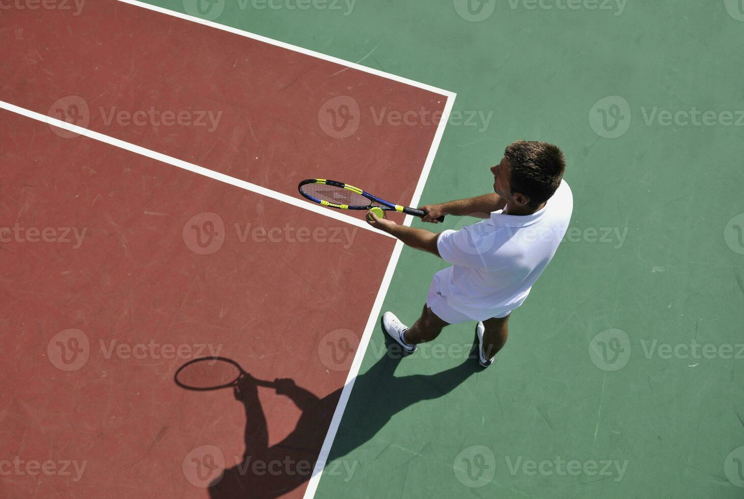 young man play tennis outdoor photo