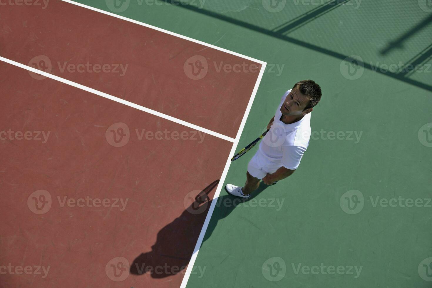 young man play tennis photo