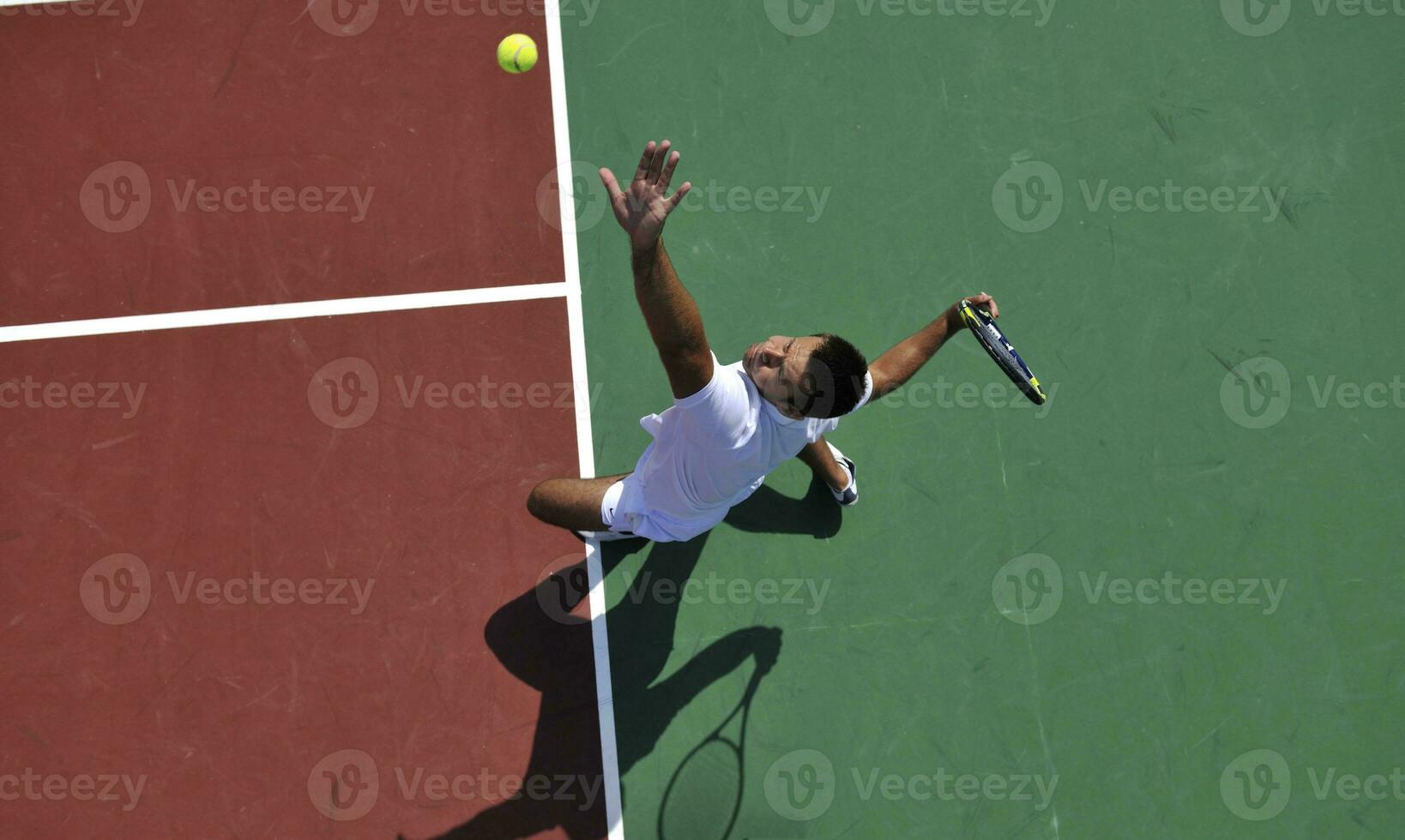 young man play tennis outdoor photo