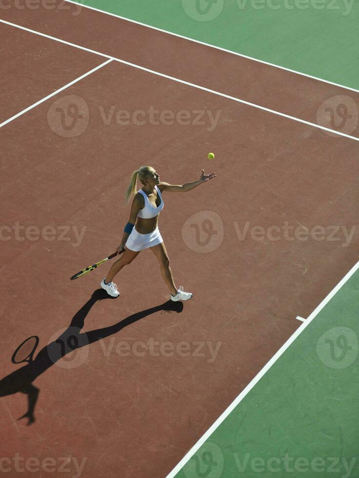 young woman play tennis outdoor photo