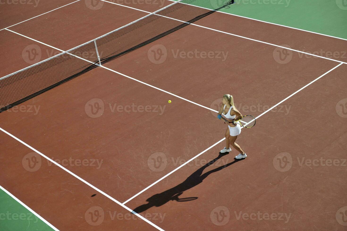 young woman play tennis outdoor photo