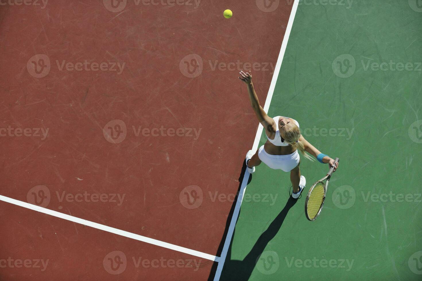 young woman play tennis outdoor photo