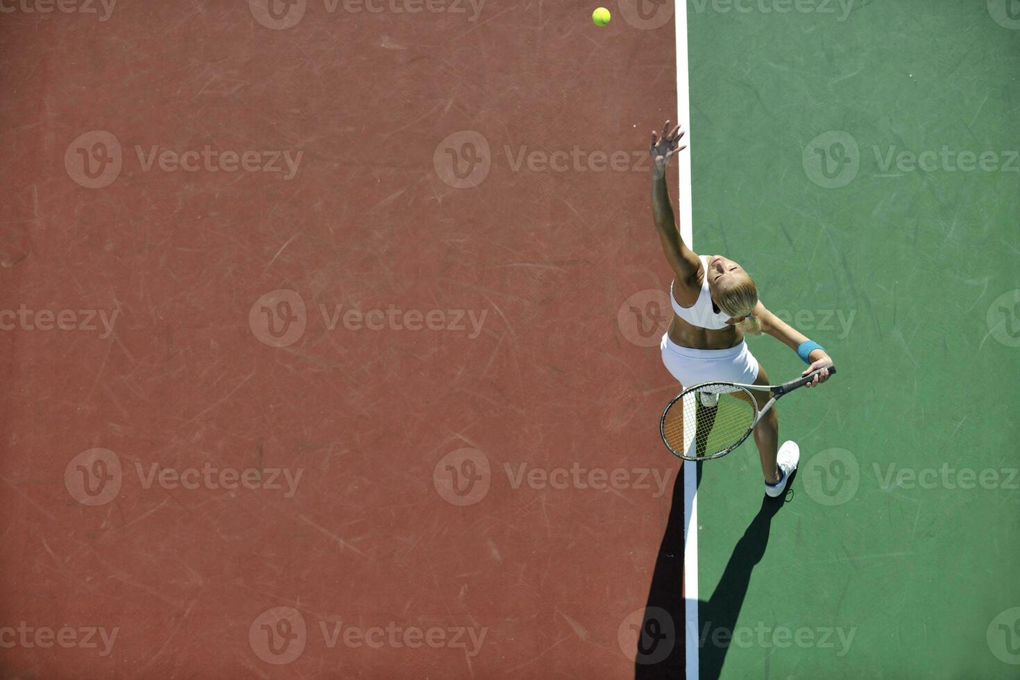 young woman play tennis outdoor photo