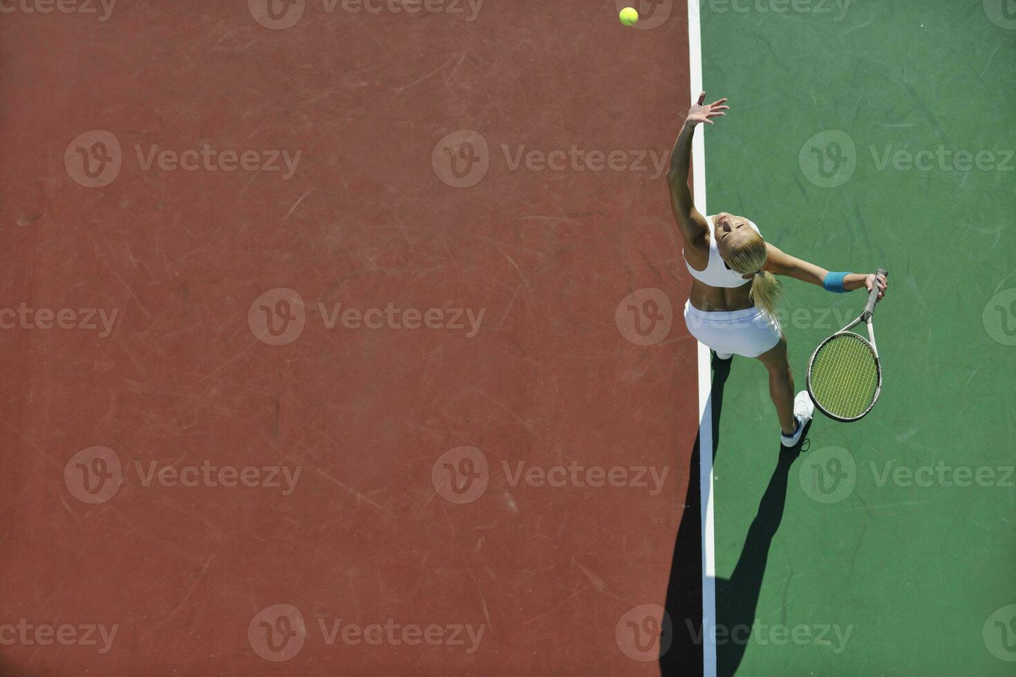 young woman play tennis outdoor photo