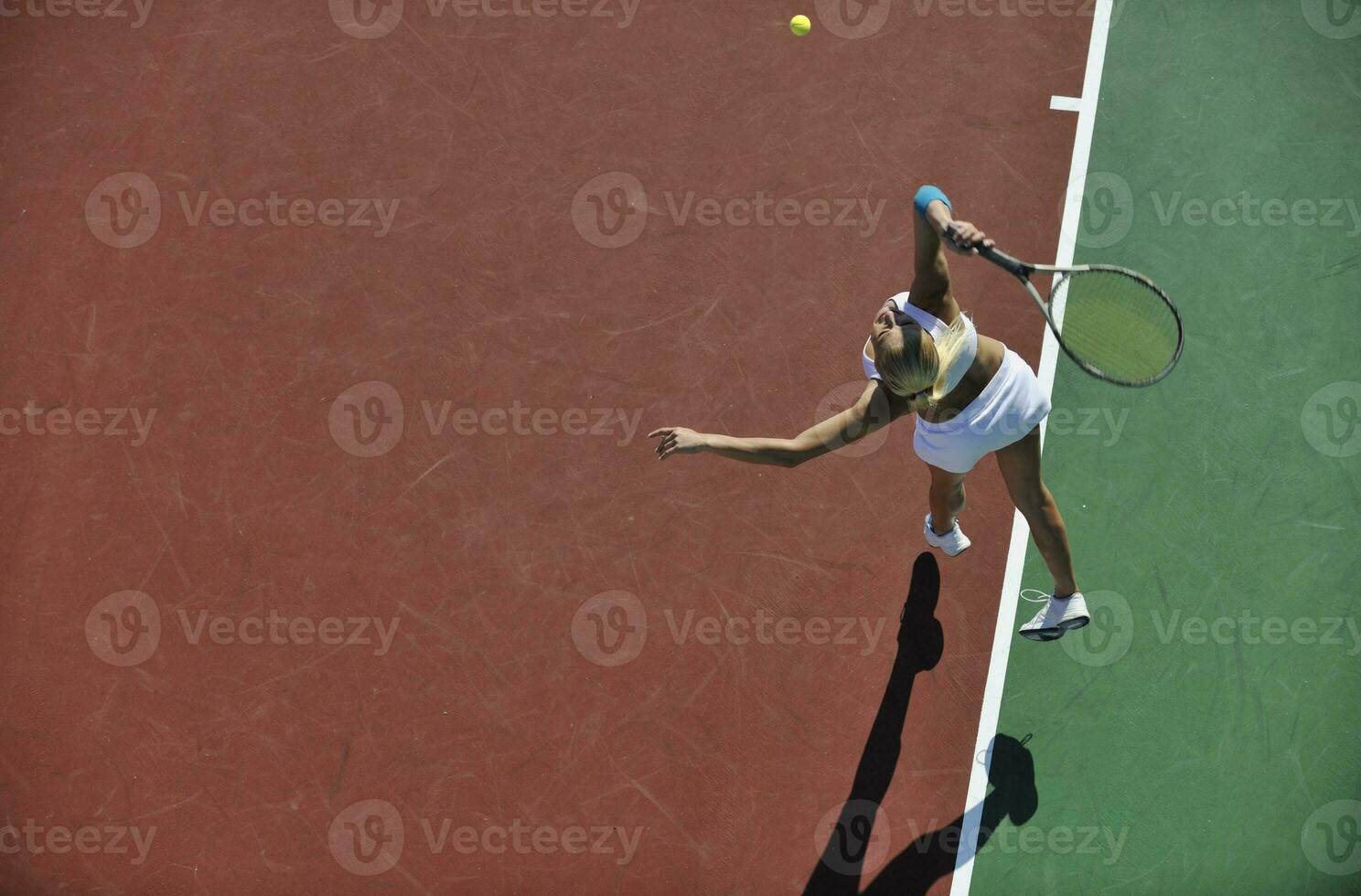 young woman play tennis outdoor photo