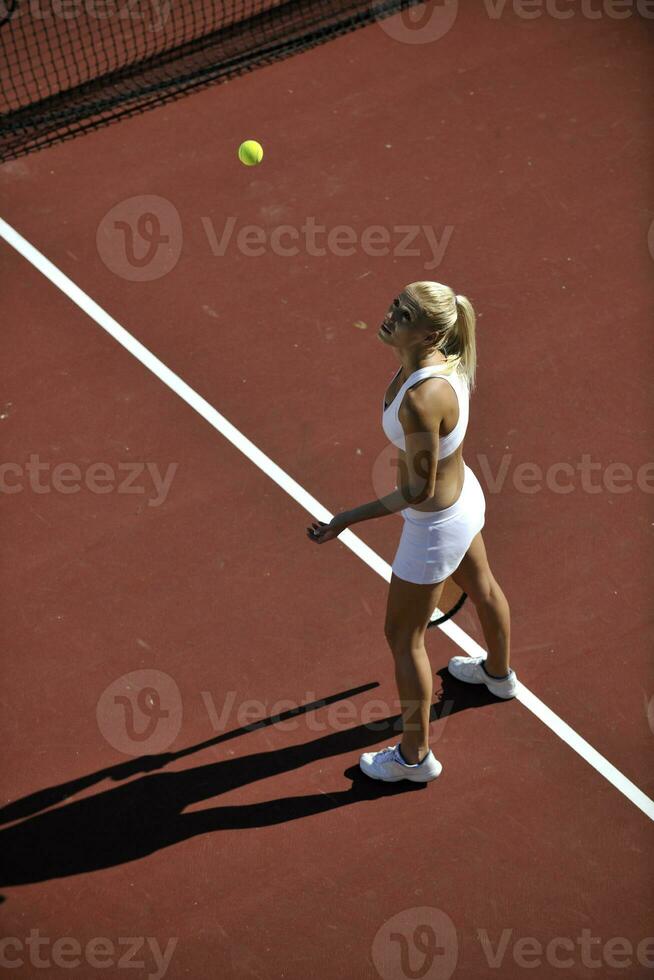 young woman play tennis outdoor photo