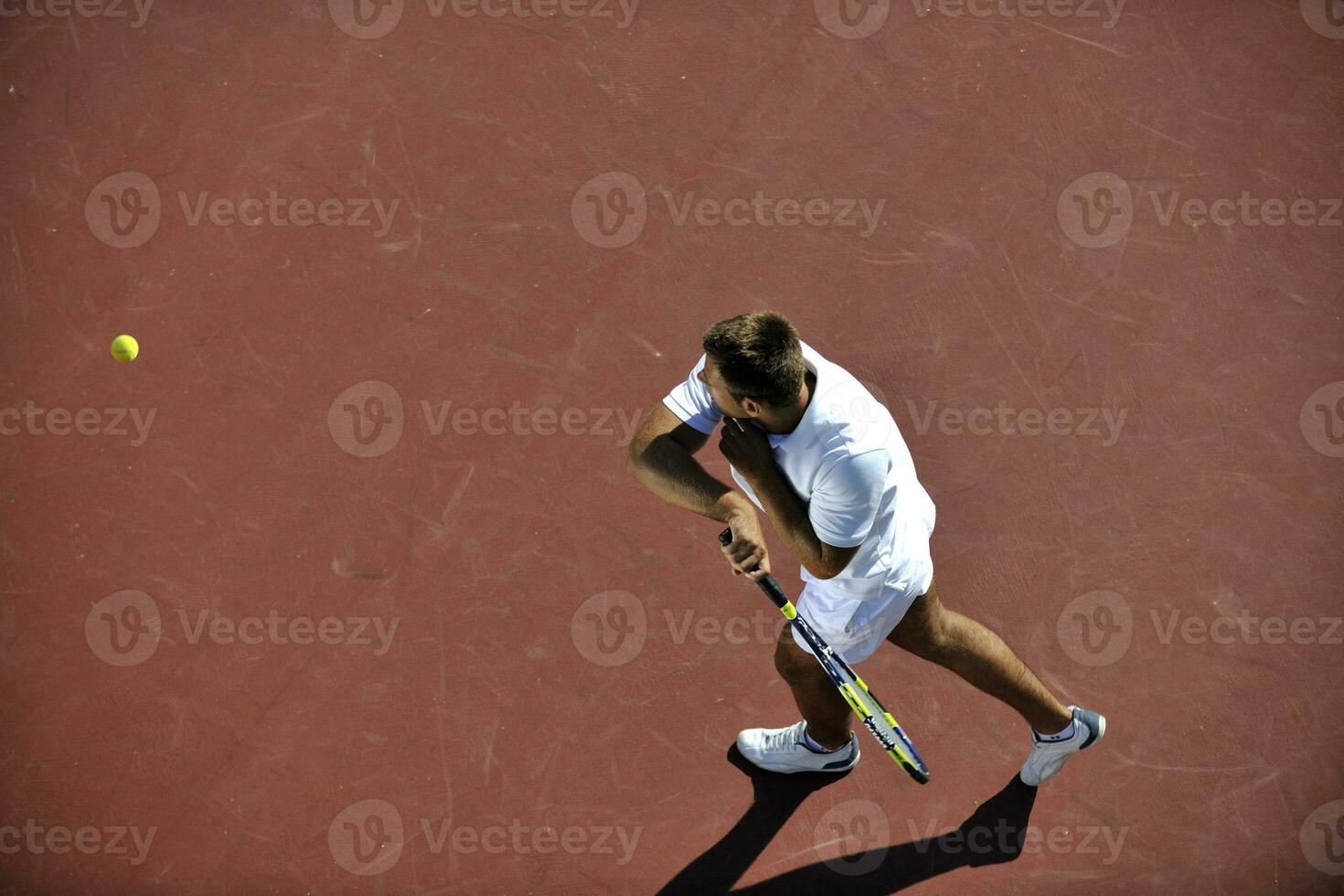 young man play tennis photo