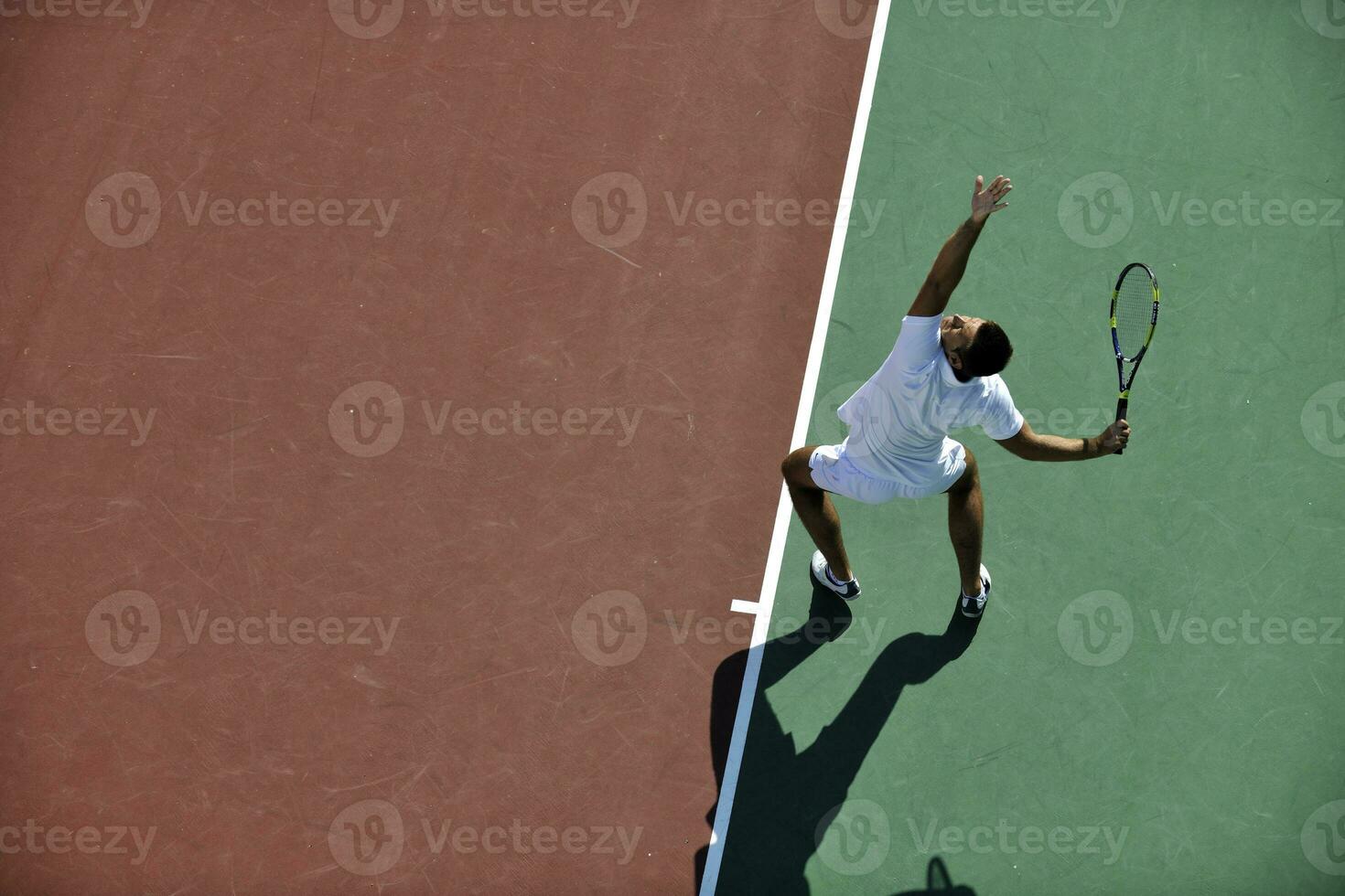 young man play tennis photo