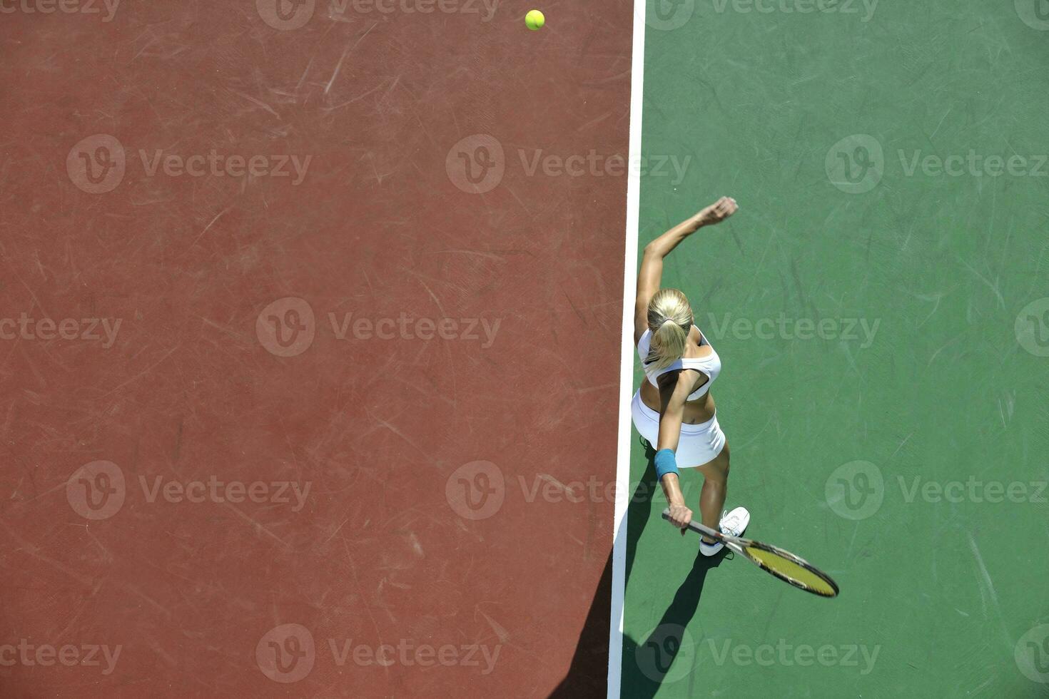 young woman play tennis outdoor photo