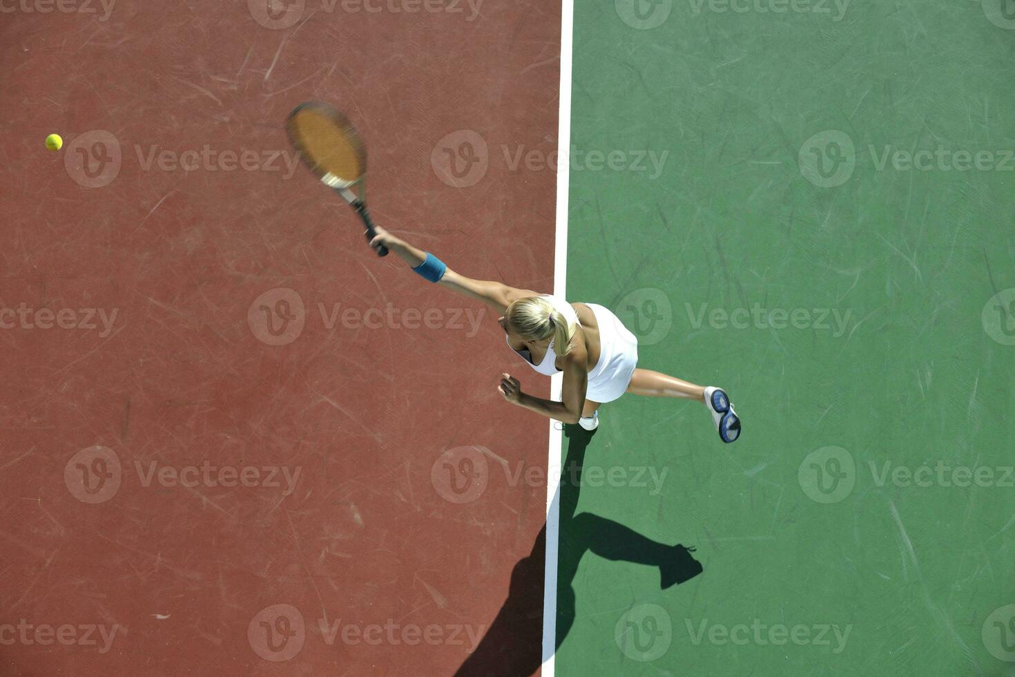 young woman play tennis outdoor photo