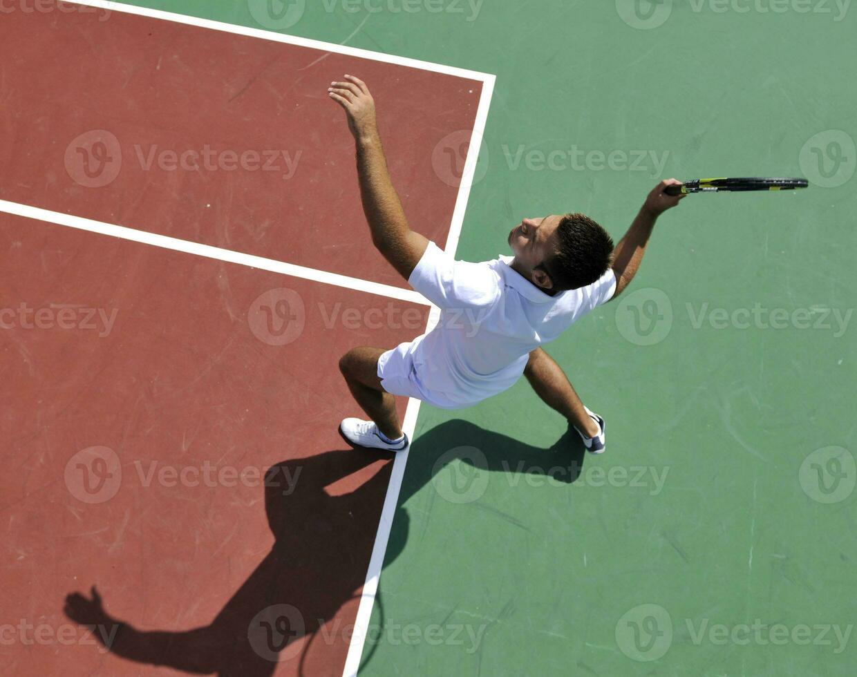 young man play tennis outdoor photo