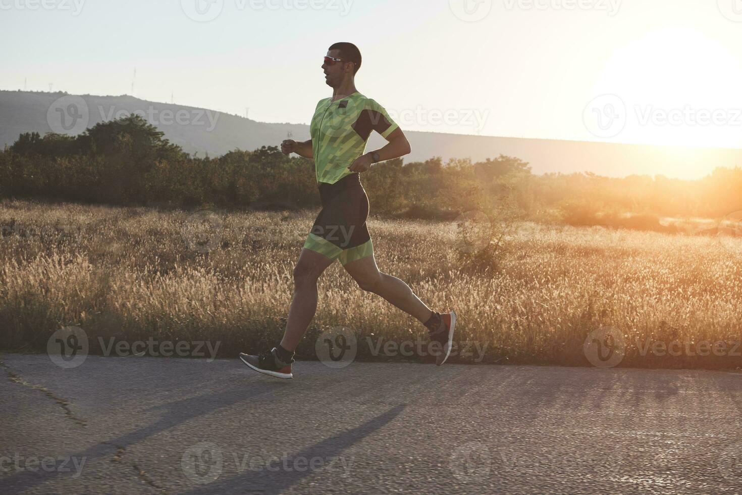triathlon athlete running on morning trainig photo